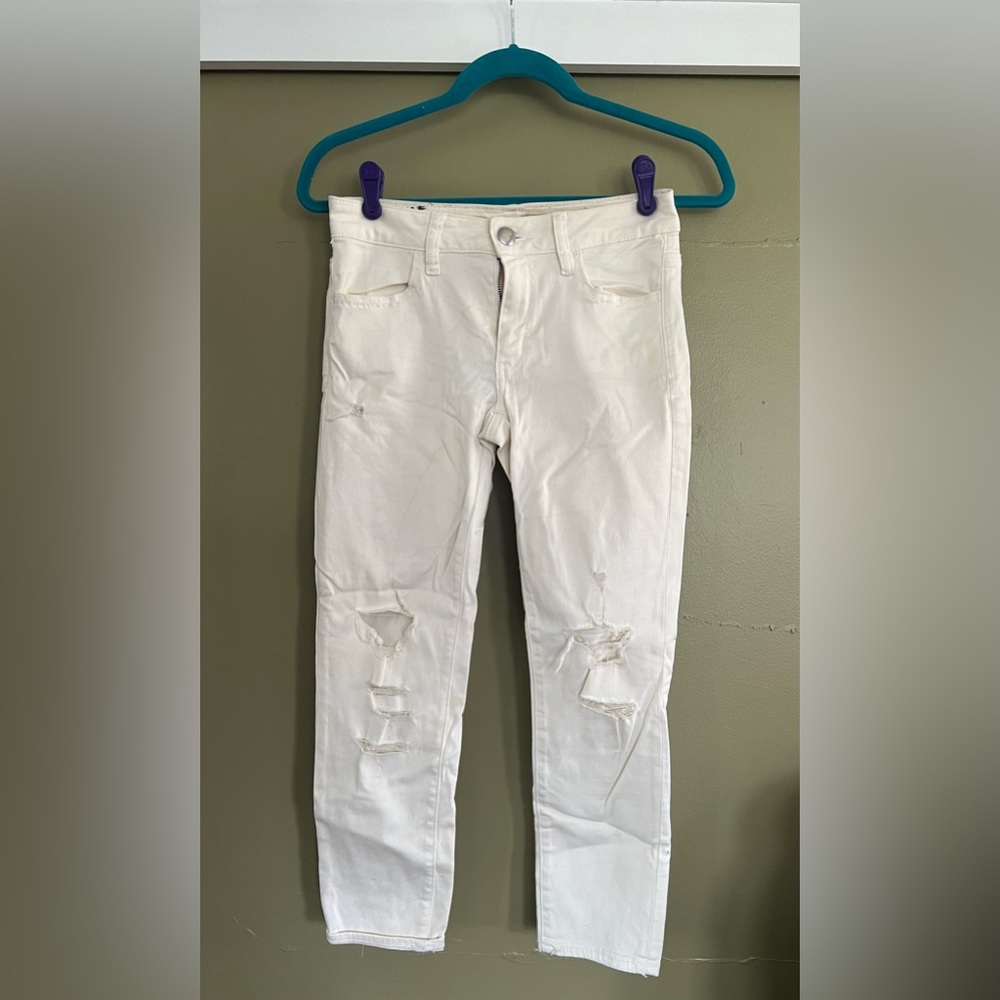 Ripped and torn woman’s jeans
